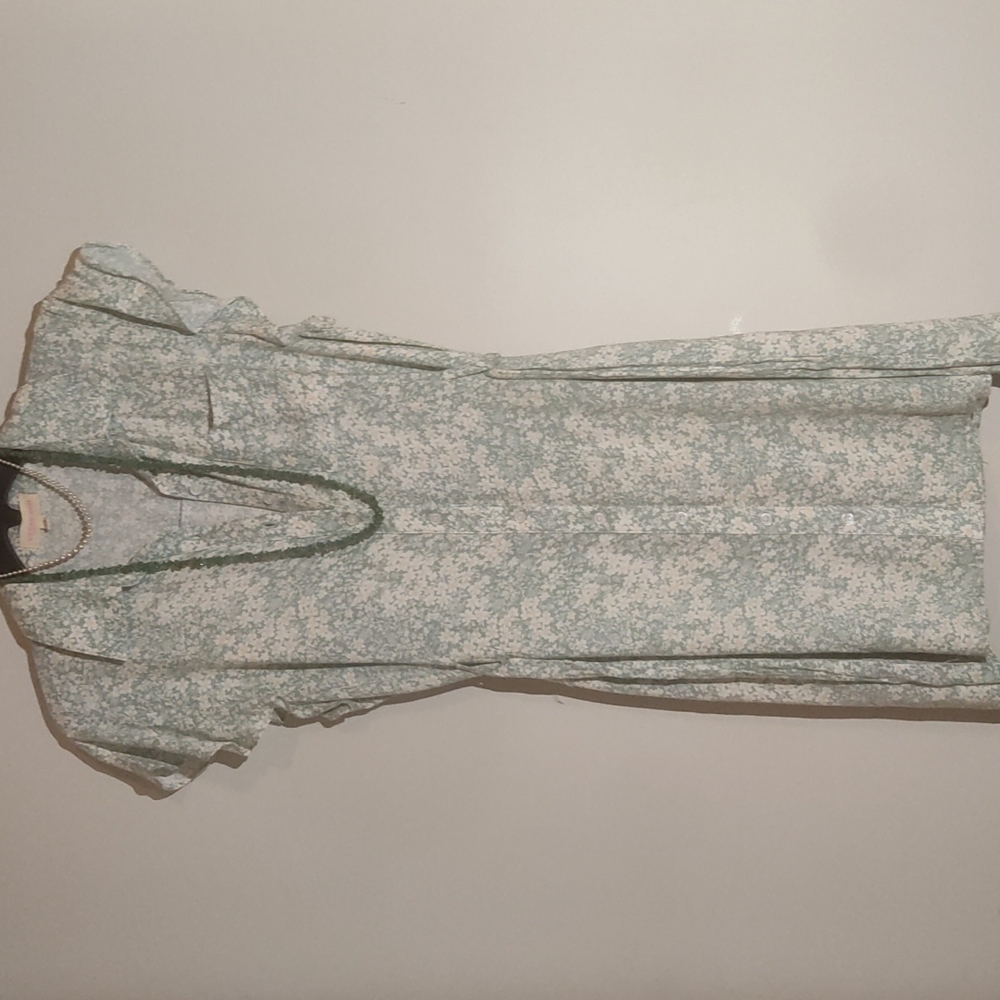Green floral pattern dress.